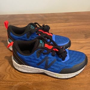 Never worn blue new balance lace up sneakers. Toddler boy size 11